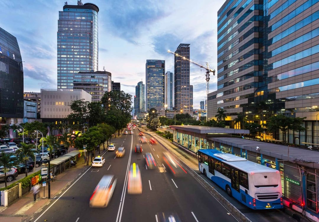 Fast moving traffic on busy city street